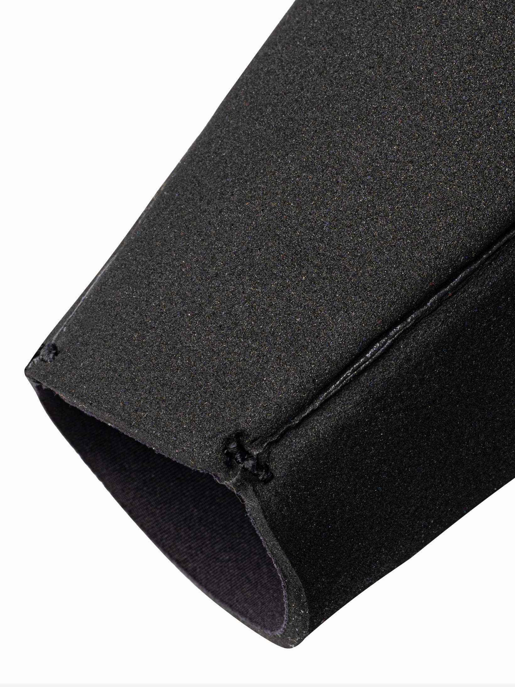Close up of the wrist seals and stiching on the open cell wetsuit which shows the open cell neoprene
