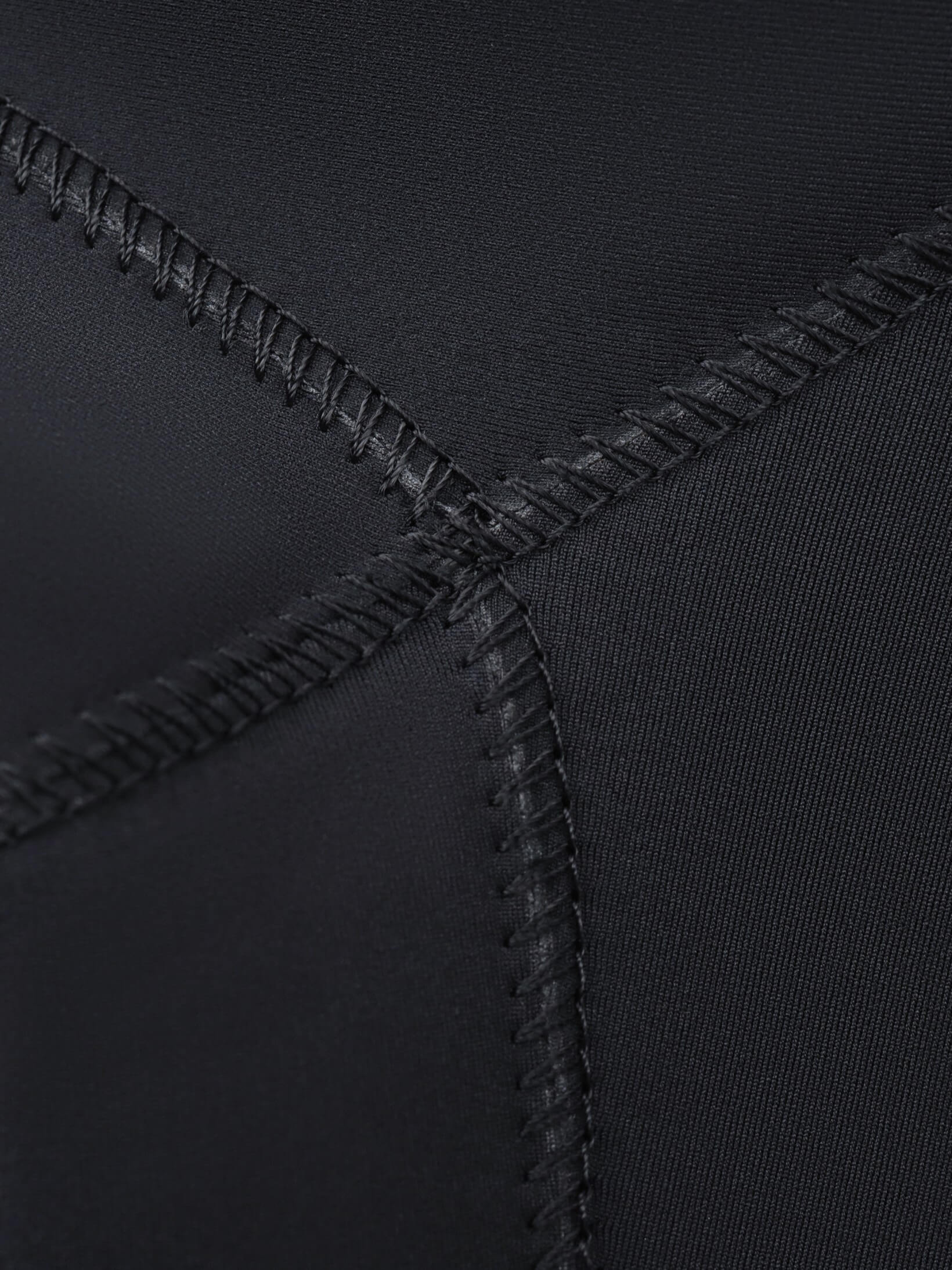 Stitching and glueing ensure female competition wetsuits survive intense training and competition dives
